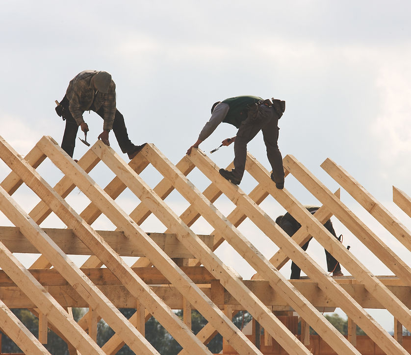 Professional roofing contractor in Toronto inspecting a roof to determine the cost of replacement